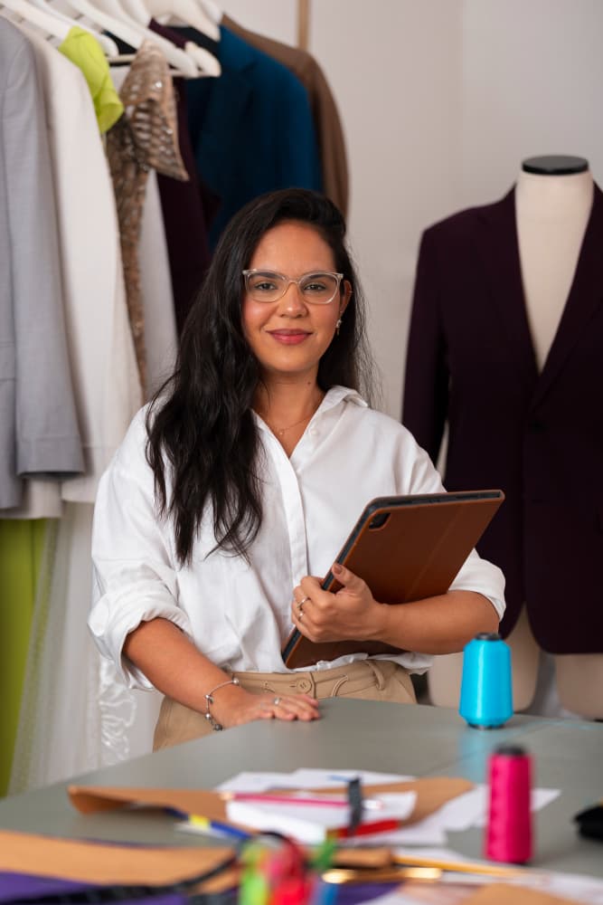 An Indian business consultant standing in her workspace